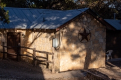 Outdoor view of cabins at sunset.