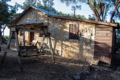 Outdoor view of cabins at sunset.