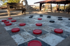 Oversized checker ground-based checkers set.