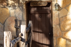 Outdoor view of cabin door at sunset.