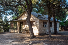 Outdoor view of cabins at sunset.