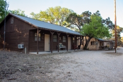 Outdoor view of cabins at sunset.