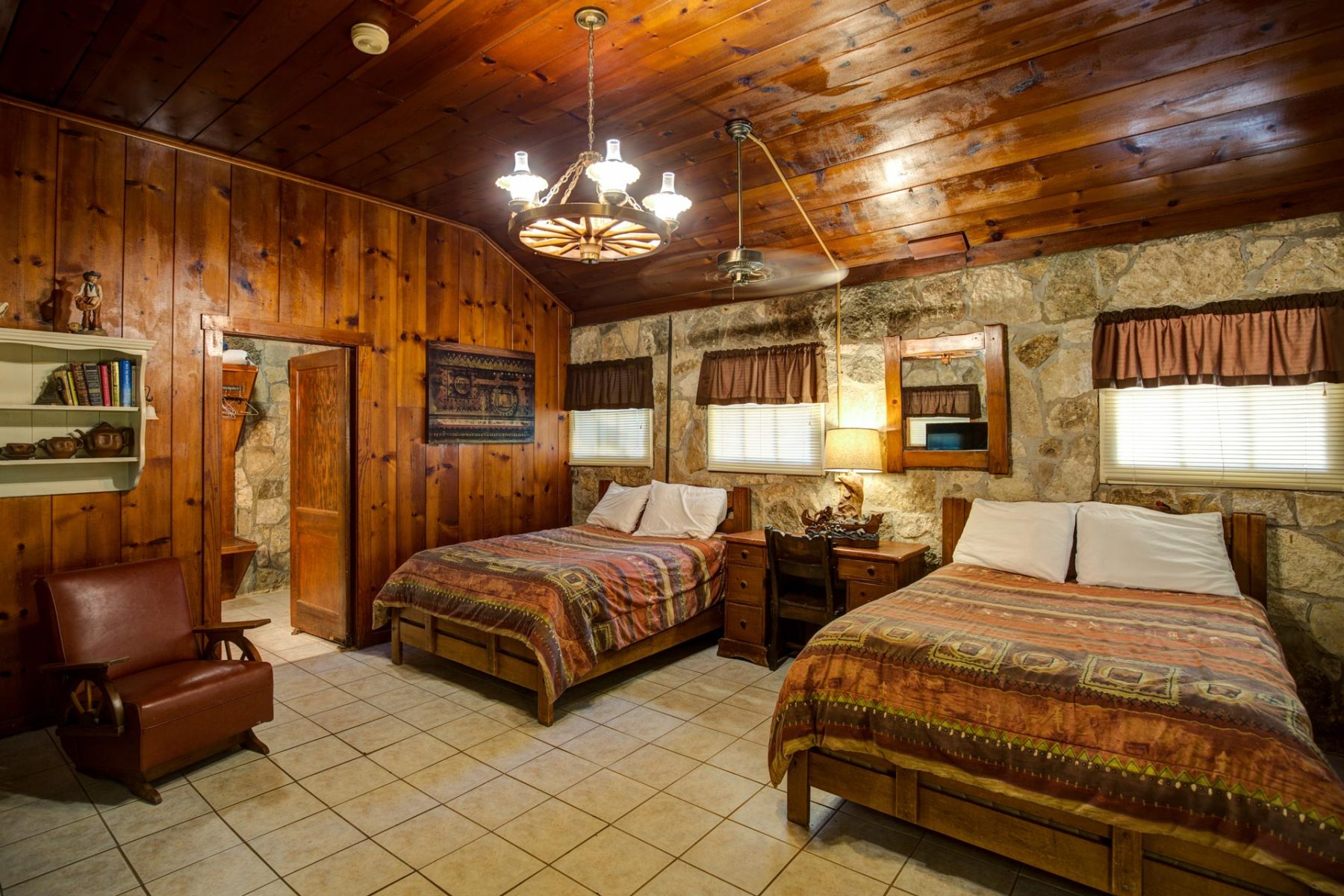 Western styled bedroom with 2 queen beds